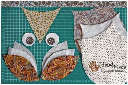 Potholder „bagoly” saját kezével (a fej tetején) Potholder „bagoly” saját kezűleg