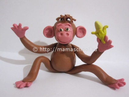 Monkey agyagból kezük (agyag kezével) Monkey agyagból kezük