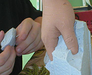 Körperteile Eine Hand in Clay