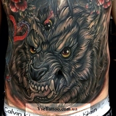 Jelentés tetoválás vigyor a farkas (a farkas feje) fotó, leírás, történelem