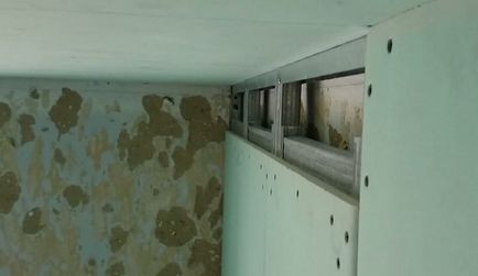 A falak készült gipszkarton kezükkel fotó, videó trim