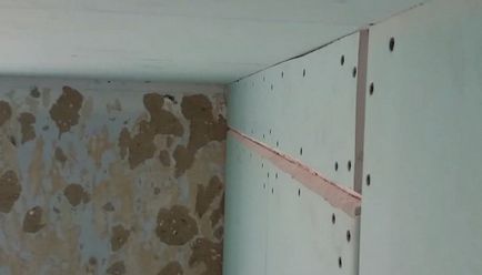 A falak készült gipszkarton kezükkel fotó, videó trim