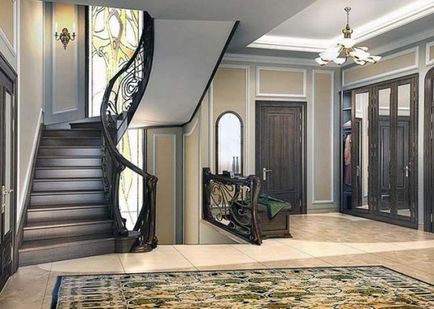 Proiectarea unei săli de intrare cu o scară într-o fotografie privată de casă