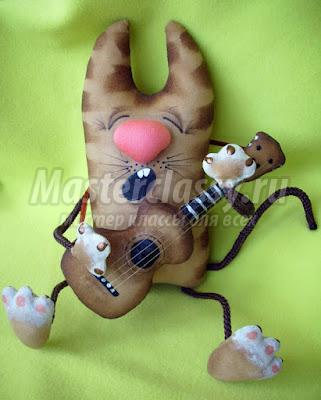 Кот з гітарою