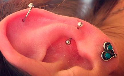 Caracteristicile piercingului de urechi sunt puncture, alegerea de bijuterii și fotografie