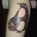 Penguin tatuaj valoare, fotografii și schițe