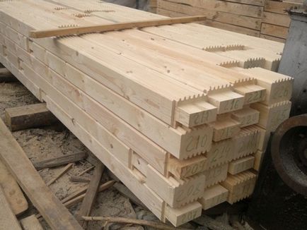 Case din lemn stratificat cu grinzi profilate si constructii