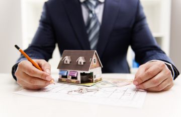 Cum se aplică pentru o ipotecă pentru a cumpăra o casă cu un teren