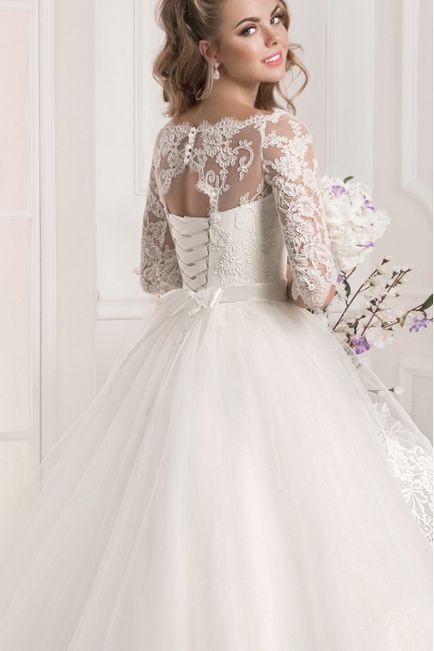Пишне весільне плаття з рукавами і знімним шлейфом в Новосибірську