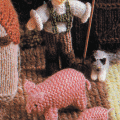 Jucarii tricotate, cu mainile, un sens giratoriu pe pat