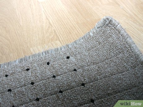 Як розгладити розкатаний килим