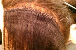 Нарощування волосся пришиванням