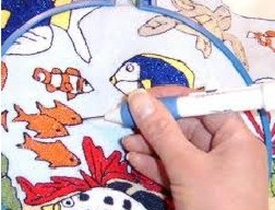 Broderie tapiserie cu un ac pentru a crea o bucla