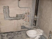Repararea canalizării într - o clădire de locuințe ca înlocuire a țevilor de canalizare și a unui șanț, și