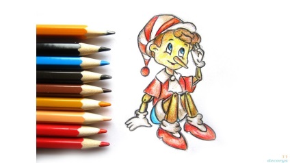 Învățând să atragă ca Pinocchio sta pe podea cu creioane colorate