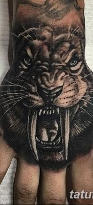 Înțeles tattoo saber-toothed tiger meaning, history, photo, sketches