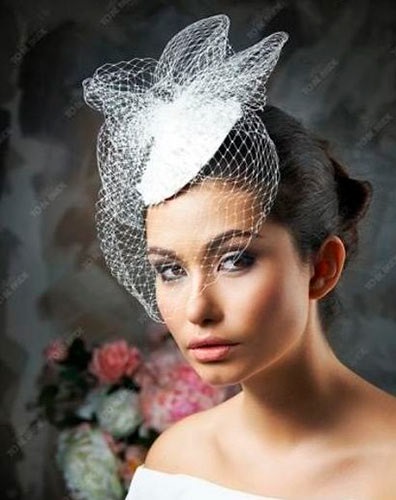 Cum de a alege și de a purta o pălărie de nuntă cu un văl