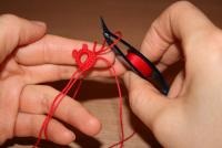 Țesutul tatting un cârlig (bucla firului de lucru) Tese un transfer de tatting