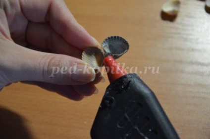 Topiara de scoici cu mâinile lor (lor) Topiara de cochilii cu propriile lor mâini