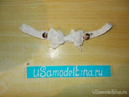 Curea cu o bandă elastică cu un arc cu mâinile lor (arc) Curea cu o bandă elastică cu un arc cu mâinile lor