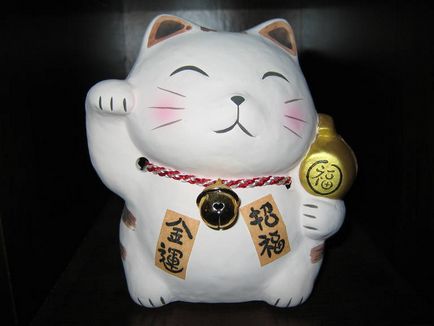Що таке maneki neko (миє свою мордочку) Що таке maneki neko