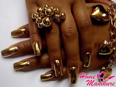 złoty manicure zrób stalowy złoty lakier do paznokci paznokcie metaliczny czarny metalik zdjęcie