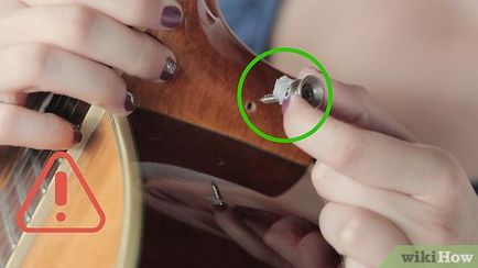 Cum să atașați cureaua la chitara