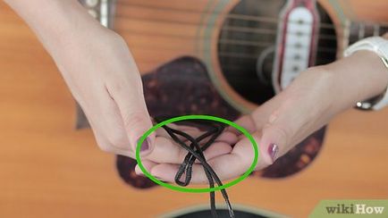 Cum să atașați cureaua la chitara